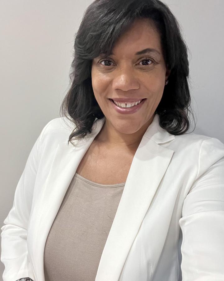 Portrait of Dr. Joy Gomez Hicks, Senior Director of Academics at Blooming College Academies